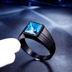Macro shot of men's square blue gemstone ring with sleek black plated stainless steel band