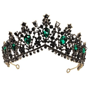 Macro detail of Baroque vintage tiara with emerald green and black rhinestones