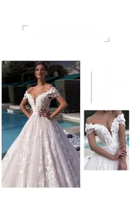 Exquisite beaded fringe detail on white off-the-shoulder wedding dress with 3D floral lace