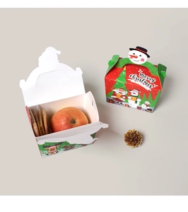 Detailed view of Christmas paper gift boxes featuring festive Santa and reindeer designs