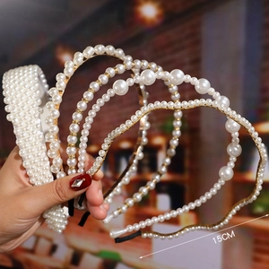 Set of assorted white pearl headbands for brides featuring a 15cm wide elegant knotted design
