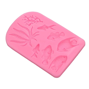 Pink silicone mold detail featuring intricate sea fish and coral patterns for ocean cakes