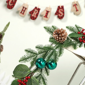 Christmas garland with peacock green PE pine needles, natural cones, and red berries