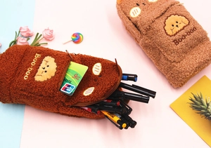 Close-up of plush brown pencil case with cute puppy embroidery and Boo-boo text detail