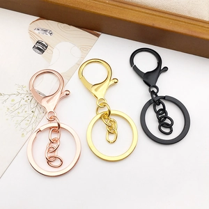 Three-piece metal keychain set with lobster clasps and rings in rose gold, gold and black