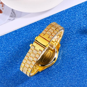 Detail view of the polished stainless steel case back and sparkling rhinestone gold band