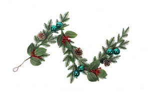 Detail of Christmas pine garland with red berries, pinecones and teal ornaments