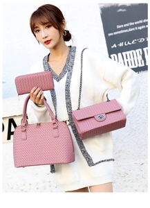 Detailed set of woven faux leather handbags in soft purple featuring a chic gold chain