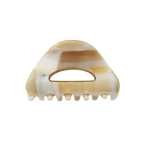 Minimalist marble tortoiseshell claw clip with cutout geometric design in cream white