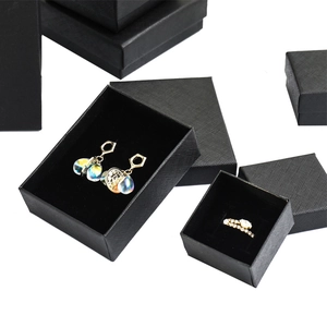 Elegant black jewelry gift boxes for rings and earrings with sponge inserts on white background