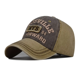 Detailed close-up of embroidered NYS and Nashville lettering on washed cotton baseball cap