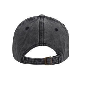Detail of adjustable metal buckle strap on a black distressed cotton baseball cap