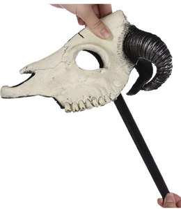 Close-up of weathered 3D sheep skull mask with black spiral horns for cosplay