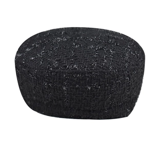 Close-up of black tweed beret with silver metallic thread and woven texture detail
