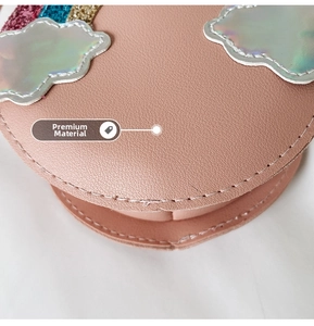 Macro shot of premium pink litchi-texture PU leather with sequin rainbow and silver cloud