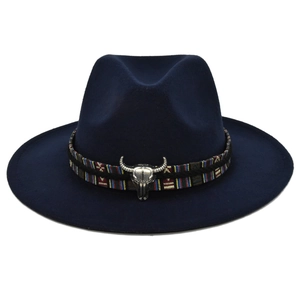 Close-up of ethnic woven band with silver metal bull head on dark blue wool fedora