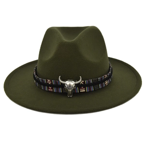 Close-up of olive green wool fedora with ethnic band and silver bull head ornament