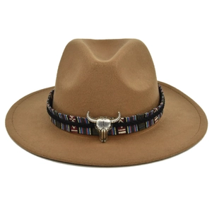 Detail of camel wool fedora hat with ethnic woven band and silver bull head ornament