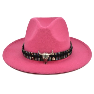 Detail of rose pink fedora hat with ethnic woven band and silver bull head pendant