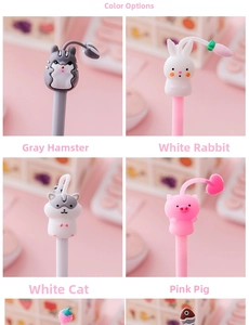 Detail of four cute cartoon animal gel pens with soft silicone tops on a pink desk