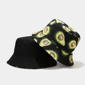 Detail view of cotton bucket hats featuring one solid black and one avocado print design
