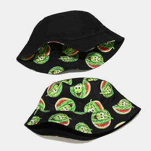 Close-up of reversible bucket hat featuring black fabric and a cartoon watermelon print