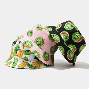 Detailed close-up showing layered display of banana and watermelon print bucket hats