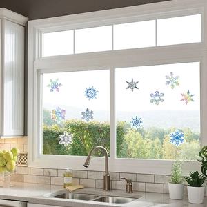 50-piece set of blue and iridescent snowflake window stickers for Christmas decor
