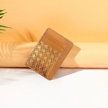 Detail of slim brown PU leather card holder with textured weave and smooth finish