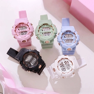 Macro shot of five digital sports watches with colorful silicone straps and digital displays