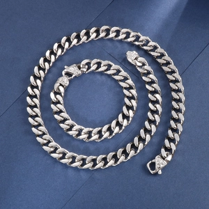 Detailed set of silver stainless steel Cuban link necklace and matching bracelet