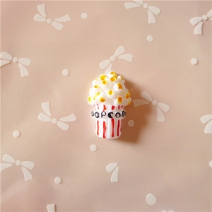 Macro shot of resin popcorn miniature charm for DIY phone cases and hair accessories