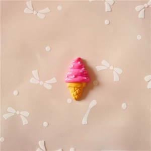 Close-up of pink resin ice cream charm for DIY phone cases and hair accessories