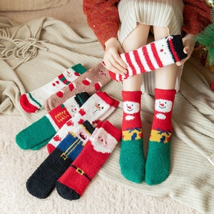 Cozy Christmas coral fleece socks featuring festive snowman and reindeer patterns