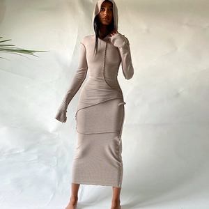 Detail of exterior seam stitching on beige long sleeve hooded bodycon midi dress