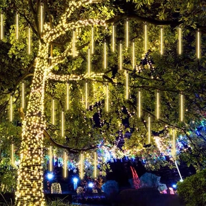 Solar warm white LED meteor shower rain lights hanging on outdoor garden trees
