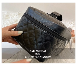 Detailed side view of black quilted PU leather makeup bag with handle and zipper