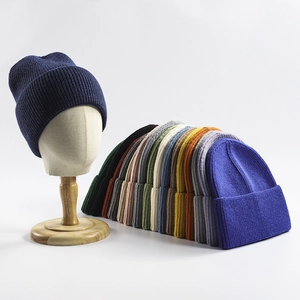 Thick knitted cuffed beanie in various solid colors for winter outdoor warmth
