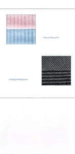 Detail of long exfoliating bath towels in striped and mesh textures for back cleaning