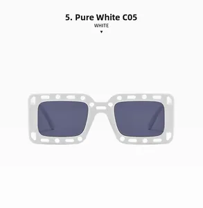 Detailansicht der rechteckigen weißen Sonnenbrille mit Cut-Out-Design und grauen Gläsern