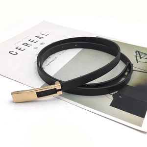 Black leather slim belt for women featuring a minimalist rectangular gold metal buckle