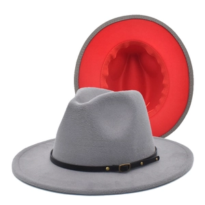 Detail of gray wool fedora with red underside featuring a black leather band and gold buckle