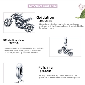 Macro detail of S925 sterling silver motorcycle pendant with oxidized finish and polished surface