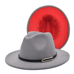 Detail view of two-tone wool fedora hat showing gray exterior and bright red interior