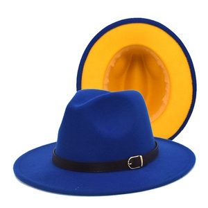 Close-up of dual-color fedora with wool texture, leather band and metal buckle detail
