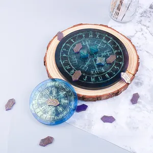 Macro detail of star-glitter blue resin rune discs on rustic wood and marble texture