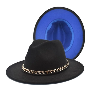 Detail of black wool fedora with gold chain and contrasting royal blue interior lining