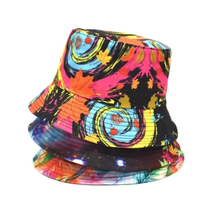 Detailed stack of printed bucket hats with maple leaf, starry sky and tropical patterns