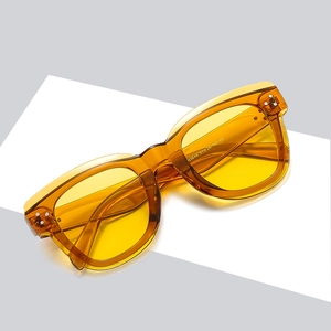Retro amber oversized sunglasses with yellow tinted lenses and thick acetate frames