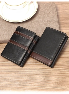 Men's tri-fold RFID leather wallet detail shown on a wooden desk with a coffee cup